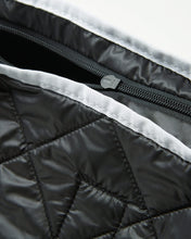 color: black ~ alt: GBY Ultralight - Quilted Gym Duffel Bag Inside Out Detail ~ info: Inside out detail